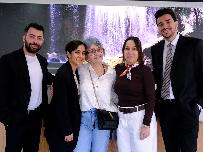 Dt. Dilek and a women who had Invisalign gives pose for cameras