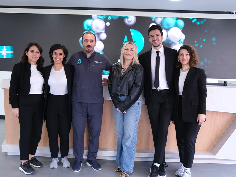 two man standing one of them had dental implant in Antlara Dental Clinic Turkey