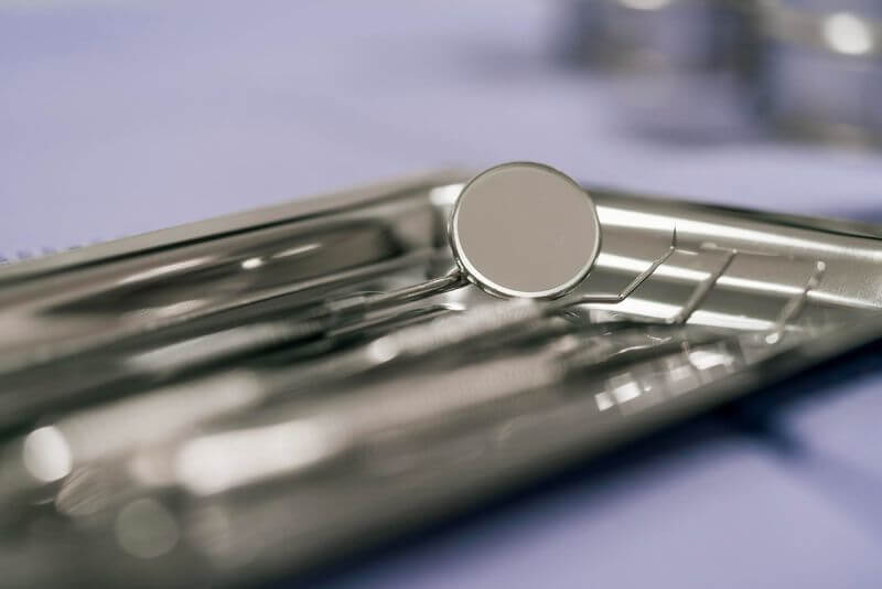 Deep Dental Cleaning instruments lay out on the dentist table.