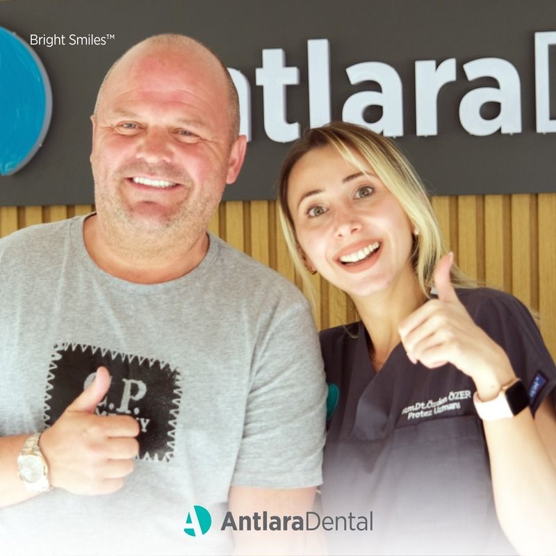man and women smiles in dental clininc in Turkey after having Root Canal Treatment (Endodontics)